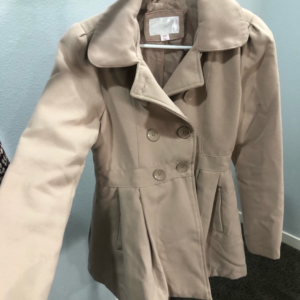 Beige peplum jacket with large buttons